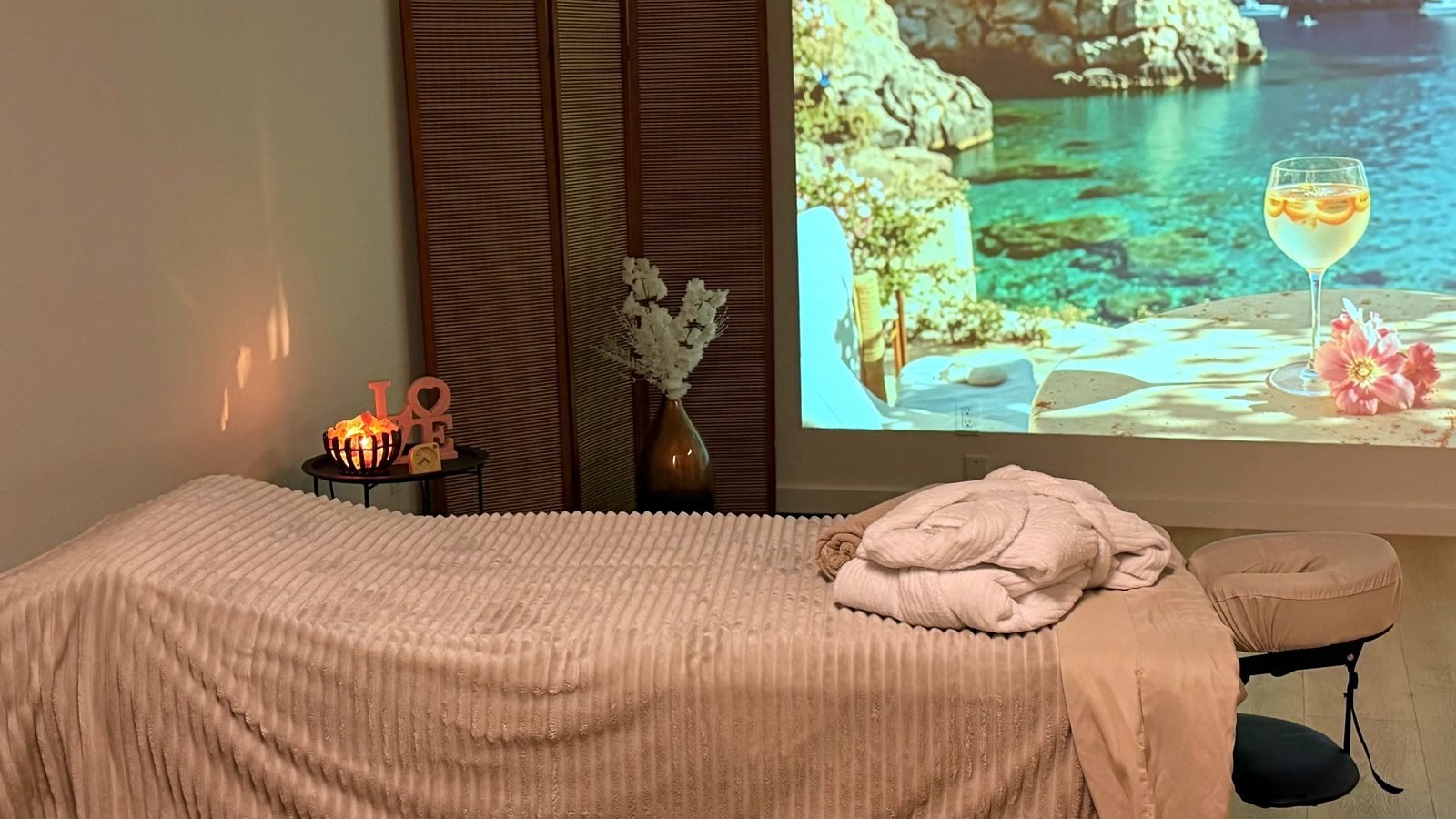 Couples massage room with a projected landscape