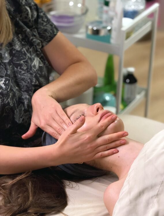 Therapist hands during a face massage at ERA