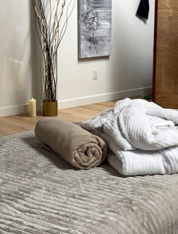 Massage table with fresh towels in an ERA treatment room